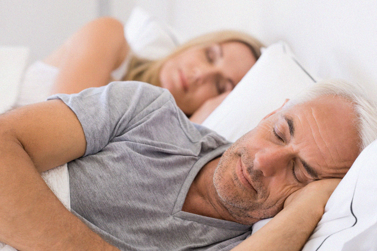 old-couple-sleeping-in-bed-together