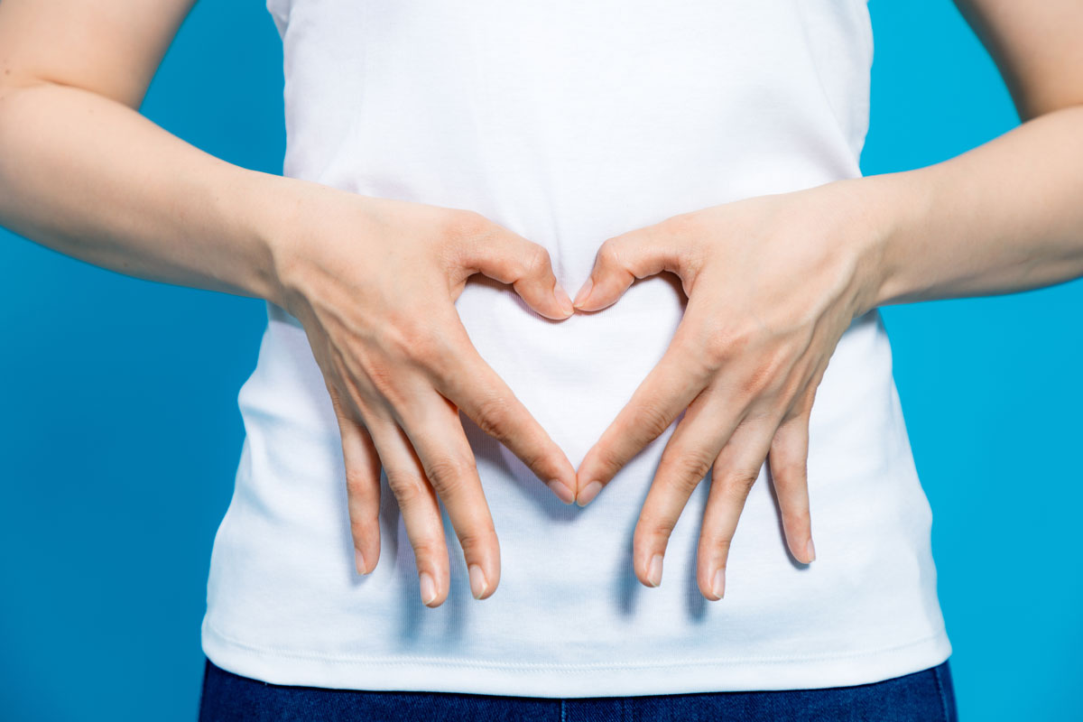 woman-showing-heart-over-her-stomach